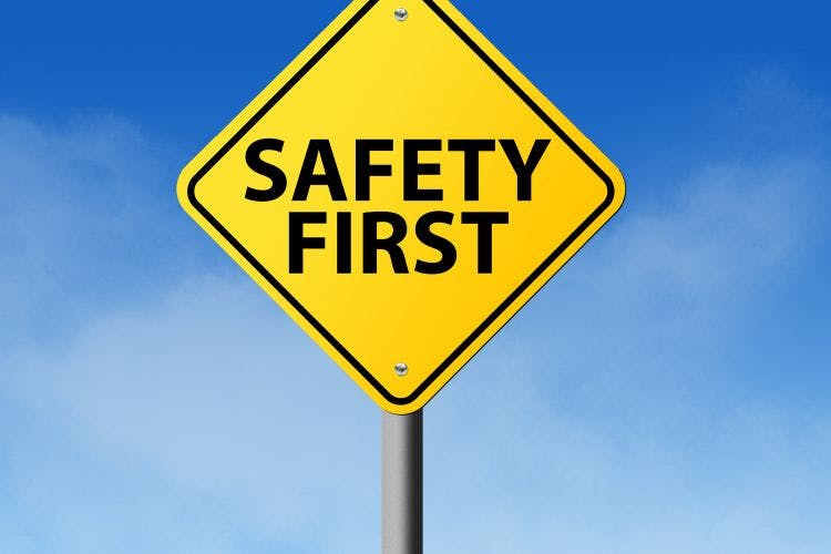 A signpost with the words "Safety First"
